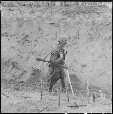 lossy-page1-220px-Vietnam....Marines_of_Company_H,_2nd_Battalion,_4th_Regiment,_walk_through_a_punji-staked_gully._-_NARA_-_532439.tif
