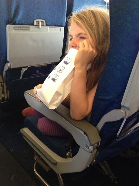 Willa barfing on the plane from Johannesburg.