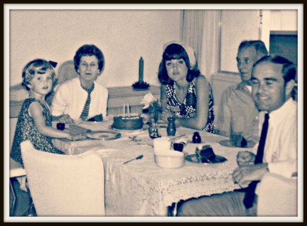 The only photo I have of my parents together before the divorce. My second birthday with my dad's parents.