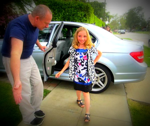 Ms. Charlotte Fox exits the vehicle to a standing ovation.