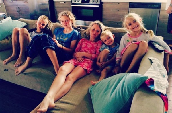 Clare and Bridget with their cousins. Blonde hair and sunburned faces.
